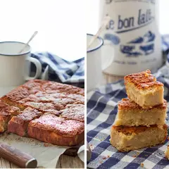 Deliciosa quesada pasiega recién horneada, cortada en porciones y apilada sobre un mantel de cuadros.