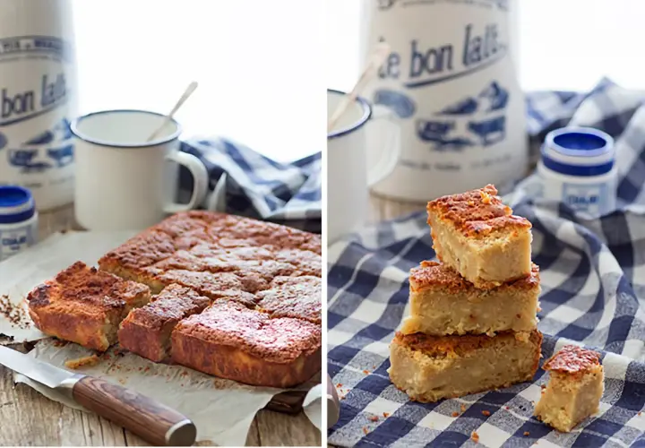 Deliciosa quesada pasiega recién horneada, cortada en porciones y apilada sobre un mantel de cuadros.